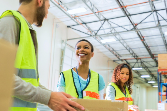 workers socializing and working in warehouse