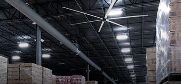 Large fan on the ceiling of a warehouse